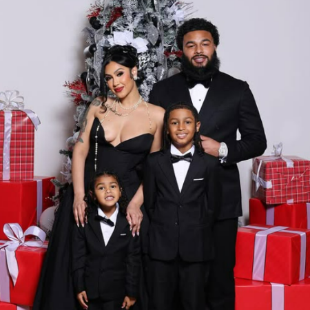 Queen Naija with her husband and children. 